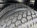 Close-up of two heavy-duty tires with deep treads designed for a 2017 Ford F-750 truck