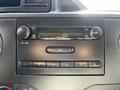 Dashboard of a 2019 Ford Econoline featuring a radio player with knobs and buttons for audio and volume control
