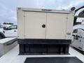 A 2005 Katolight SED60FPJ4 generator with a beige exterior and black base featuring two doors on the front