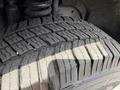 Close-up of a tire from a 2008 Ford F-250 SD showing tread pattern and rubber texture