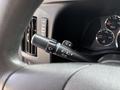 Steering column control lever in a 2020 Chevrolet Express with indicators for headlights and windshield wipers