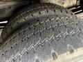 Close-up of two worn tires from a 2009 Morgan Olson Workhorse showcasing visible tread patterns and signs of use
