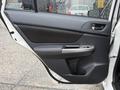 A white 2016 Subaru Crosstrek door with a textured panel and a silver door handle