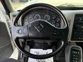 Steering wheel of a 2011 International WorkStar showing dashboard gauges and controls designed for heavy-duty vehicle operation