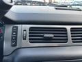 The dashboard of a 2011 Chevrolet Avalanche featuring air conditioning vents and control buttons