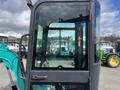 2024 AGT Industrial Green QH13R Mini Excavator with a glass cabin showcasing the interior controls and seating area