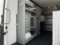 Interior of a 2017 Mercedes-Benz Sprinter with metal shelves and drawers for storage