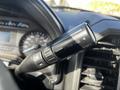 A close-up view of the tow haul toggle switch located on the steering column of a 2018 Ford F-550