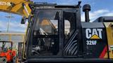 Caterpillar 326F L Excavator with a cab featuring large windows and a prominent CAT logo on the side