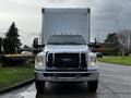 Front view of a 2022 Ford F-750 with a large box truck body and prominent grille features