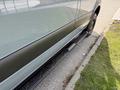 2019 Mercedes-Benz Sprinter showing the side view with a step bar and black bodywork