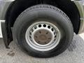 Close-up of a wheel and tire from a 2012 Mercedes-Benz Sprinter showing alloy rim design and tire tread