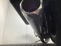 A close-up view of the chrome exhaust pipe of a 2019 Harley-Davidson FLHX motorcycle showing the polished surface and curvature of the pipe