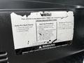 A faded instruction sticker for a VMAC air compressor system attached to the interior of a 2006 GMC C5000 detailing start-up and shutdown procedures