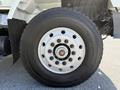 Close-up of a tire mounted on a wheel from a 2009 International 7500 showing the tread pattern and hub assembly