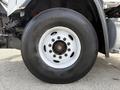 A close-up of a wheel from a 2016 Freightliner 108SD showcasing the tire tread and rim design