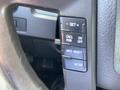 Dashboard buttons and controls from a 2012 Ford F-150 including settings for cruise control and information reset