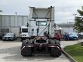 A 2012 Volvo VNL truck viewed from the rear showcasing its cab and chassis with large tires and a visible exhaust pipe