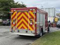 A red 2007 Ford F-550 emergency vehicle with a rear chevron pattern and multiple lights installed on top and sides