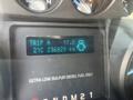 Dashboard display of a 2015 Ford F-450 SD showing trip information and fuel details with illuminated gauges