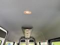 Interior view of a 2023 Mercedes-Benz Sprinter cargo van featuring a ceiling with overhead lights and a smooth finish
