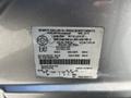 A vehicle information label from a 2013 Lincoln MKT detailing specifications including weight and tire information