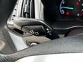 Close-up of a turn signal lever inside a 2019 Ford Transit Connect featuring arrow symbols for left and right turn signals