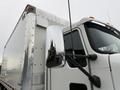 A 2017 Kenworth T370 truck with a shiny side mirror and a white box trailer visible in the foreground