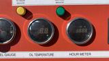 A panel featuring gauges showing fuel level oil temperature and a digital hour meter with a reading of 1000 hours