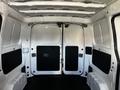 Interior of a 2017 Nissan NV200 cargo van showing a spacious empty cargo area with two rear doors and rubberized flooring