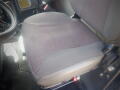 The image shows the driver's seat of a 2016 International WorkStar 7500 with a dark fabric design and visible wear on the surface