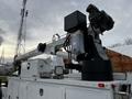 A 2016 Ford F-550 equipped with a crane and camera system, mounted with various operational tools and lights