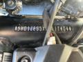 A close-up view of the engine components of a 2021 Harley-Davidson RA1250 S with visible identification numbers and wiring