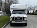 2016 Ford Econoline with a white exterior and a raised roof designed for accessibility featuring a front view and large side mirrors