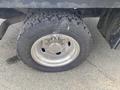 Close-up of a tire and wheel on a 2017 Ford F-550 showcasing a rugged tread pattern and shiny chrome rim