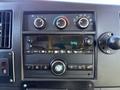 Dashboard controls of a 2019 Chevrolet Express featuring dials for climate control and a radio display showing the time 3:46