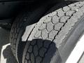 Close-up of a tire on a 2021 Hino 338 showcasing its tread pattern and dual configuration
