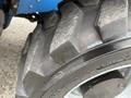 Close-up of a tire from a 2020 Genie GTH-5519 featuring a rugged tread pattern and visible wear on the surface