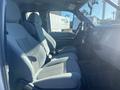 Interior view of a 2014 Ford F-250 SD showing two front seats with gray fabric upholstery and a dashboard with controls