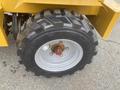 Close-up of a tire from a 2024 AGT KRW 23 Mini loader featuring a rugged tread design and a metallic rim