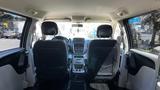 Interior view of a 2016 Dodge Grand Caravan showing front seats dashboard and center console