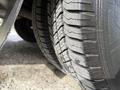Close-up of the tires on a 2020 Chevrolet Express showing tread patterns and rubber surfaces