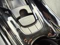 Close-up of the control panel in a 2021 Toyota C-HR featuring buttons for parking brake and drive modes