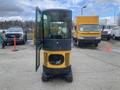 A 2024 AGT Industrial H13R Mini Excavator with an open cab and distinct yellow and black exterior featuring large wheels and a visible engine compartment