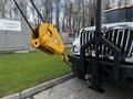 A yellow winch with a hook is attached to the front of a 2008 International 7500 truck