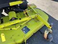 A bright yellow mower attachment for a Kubota F3990 featuring a large cutting deck and wheels for maneuverability