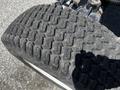 Close-up of a worn tire from a 2018 New Holland Boomer 45 showcasing a distinct tread pattern and visible signs of usage