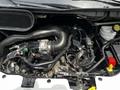 Engine compartment of a 2022 Ford Transit showing various components including hoses sensors and tubes