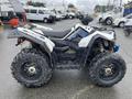 2017 Polaris Scrambler with large knobby tires and a sporty design featuring a white and black chassis