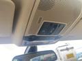 Interior overhead console of a 2009 BMW X5 featuring light controls and sunroof buttons